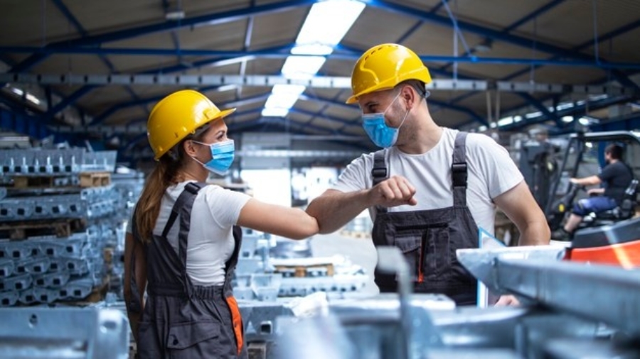 factory-workers-greeting-each-others-with-elbows-during-corona-virus-pandemic_342744-103