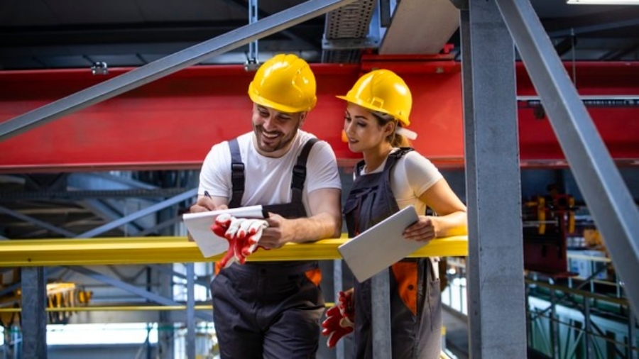 factory-workers-protective-equipment-standing-production-hall-sharing-ideas_342744-247